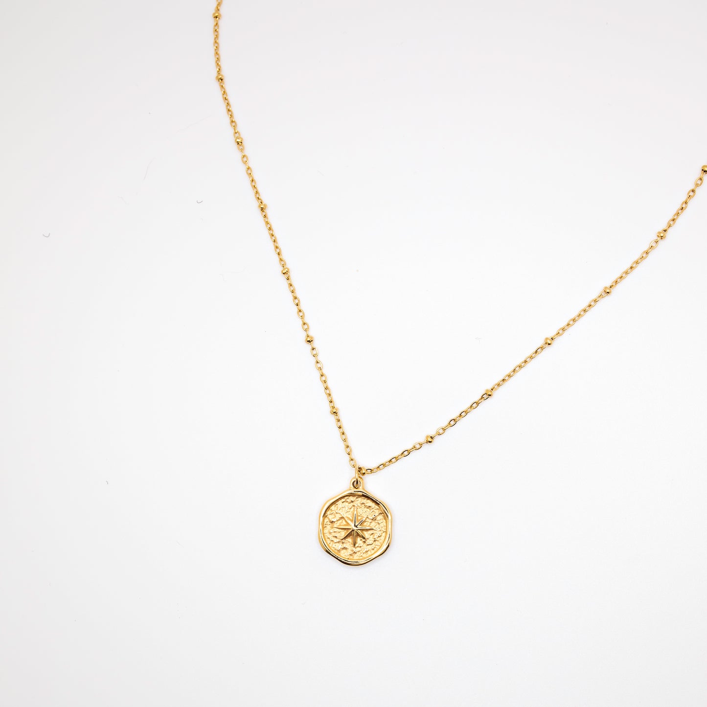 Gold compass necklace with gold beads