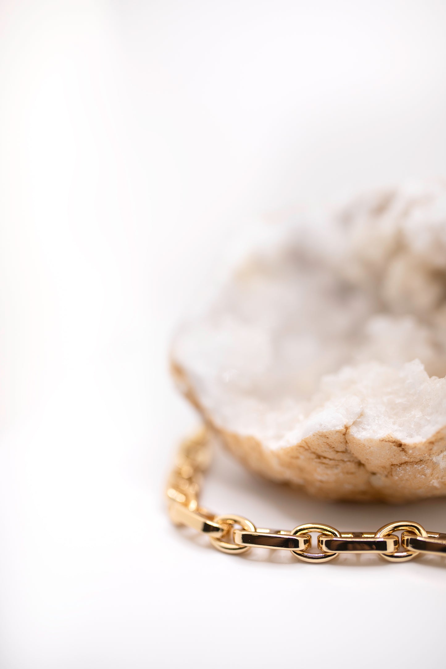 Gold chain and crystal rock