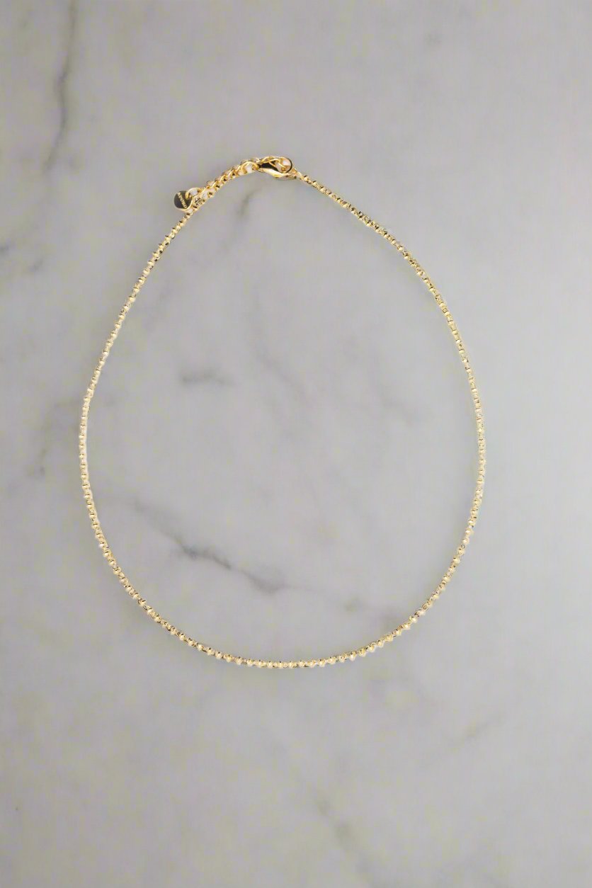 Gold beaded necklace for layering