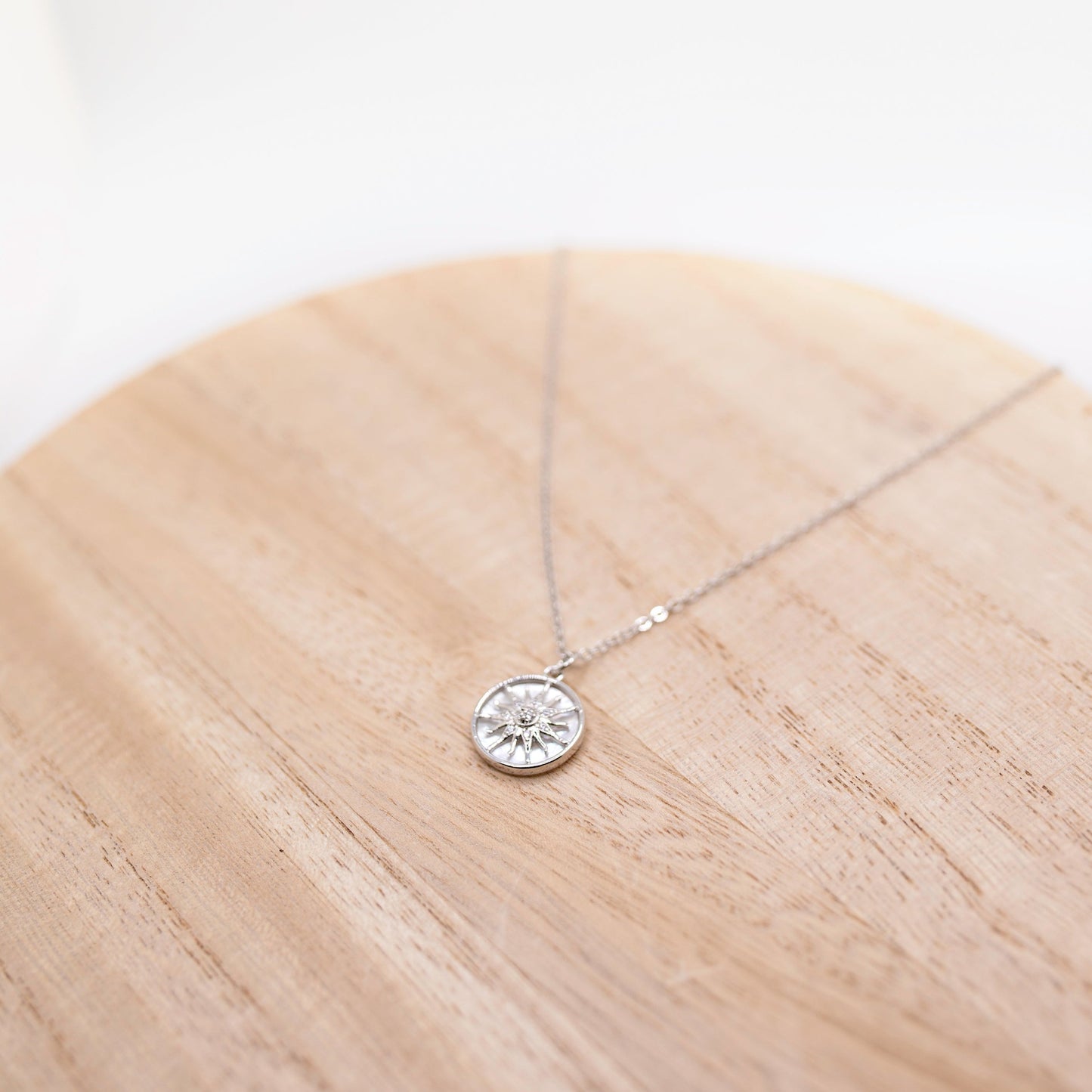 small silver sun necklace