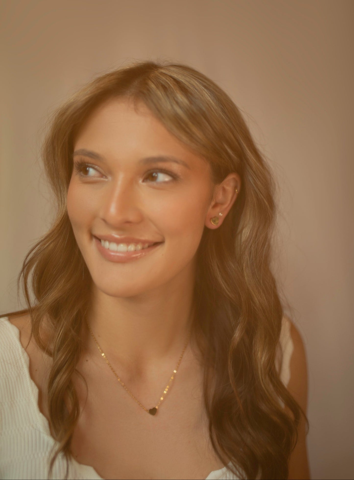 Gold Whitney and Charlie heart jewelry