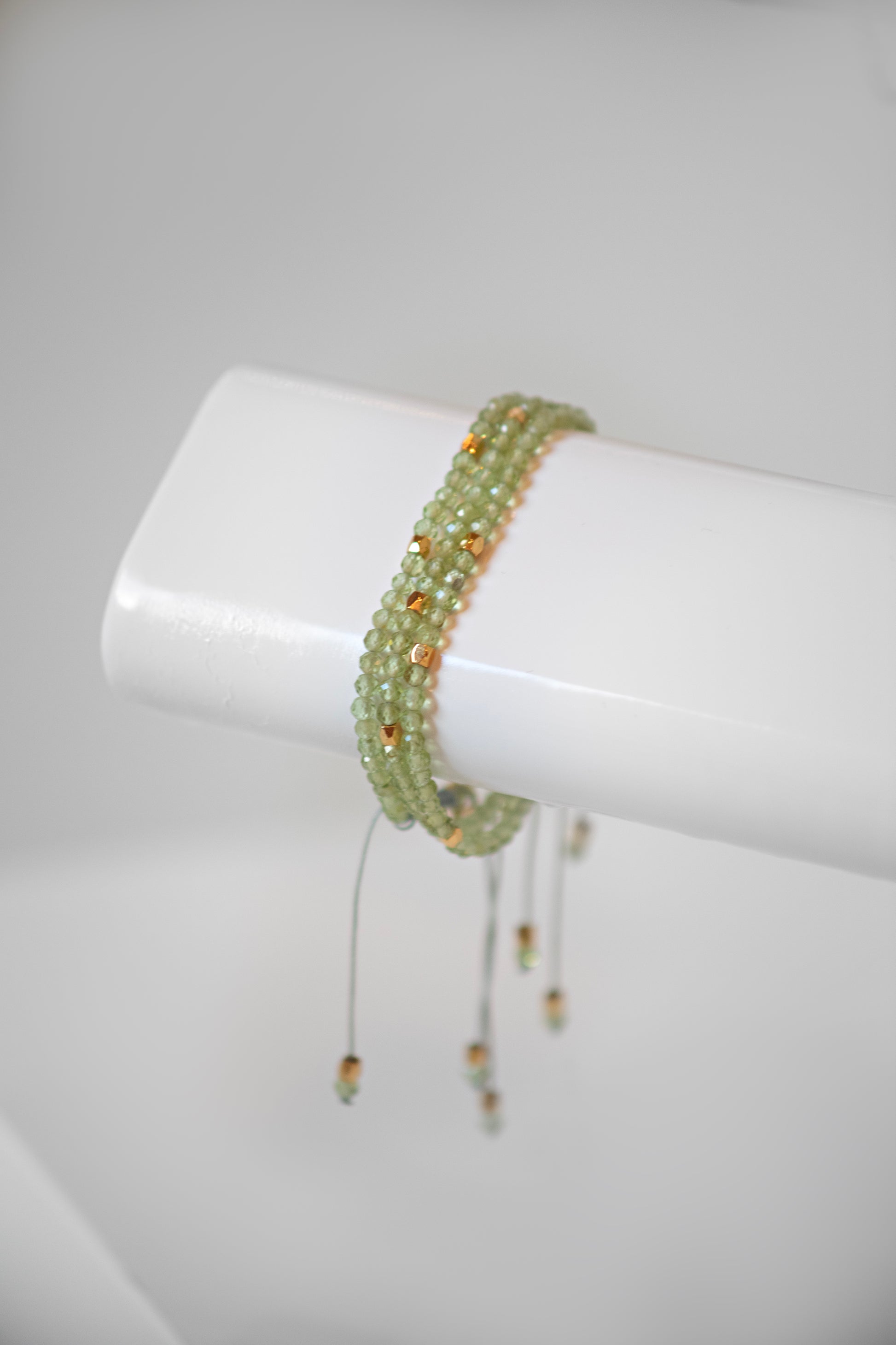 Peridot sage green bead bracelets with gold spacer bead with adjustable slide knot