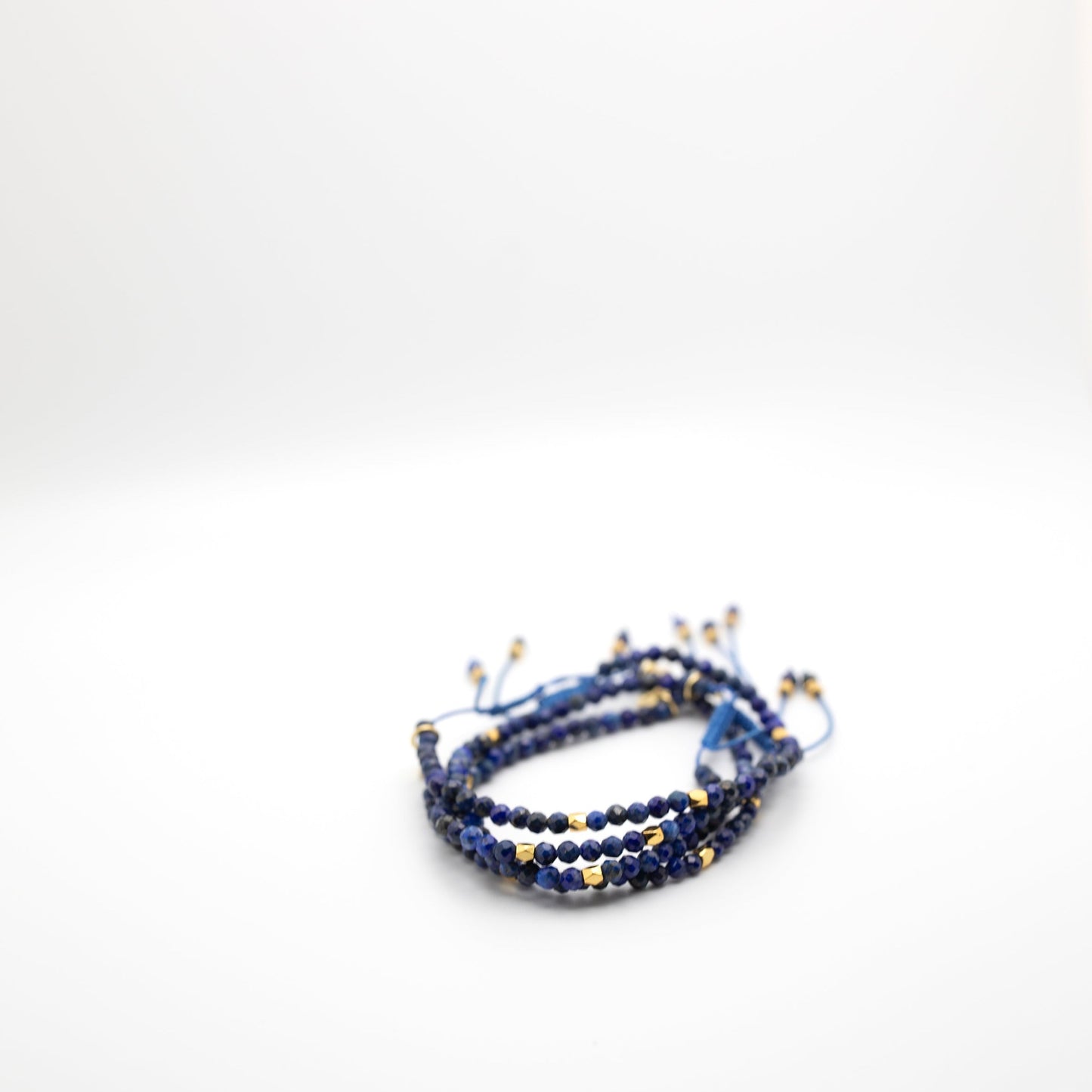 Lapis inspired beads in dark blue with gold spacers