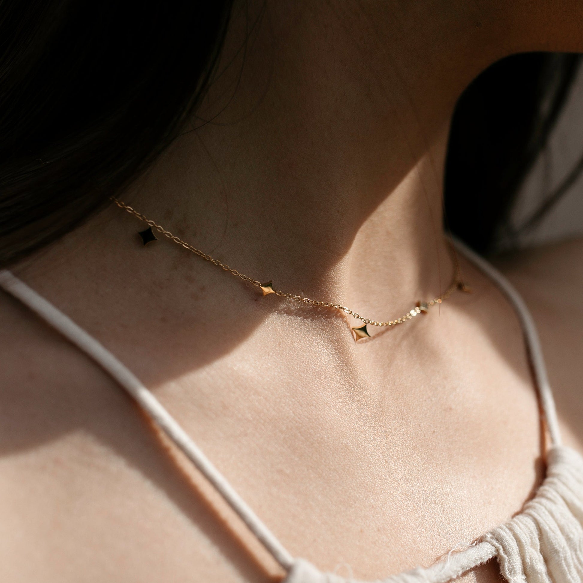 North star necklace with drops in gold