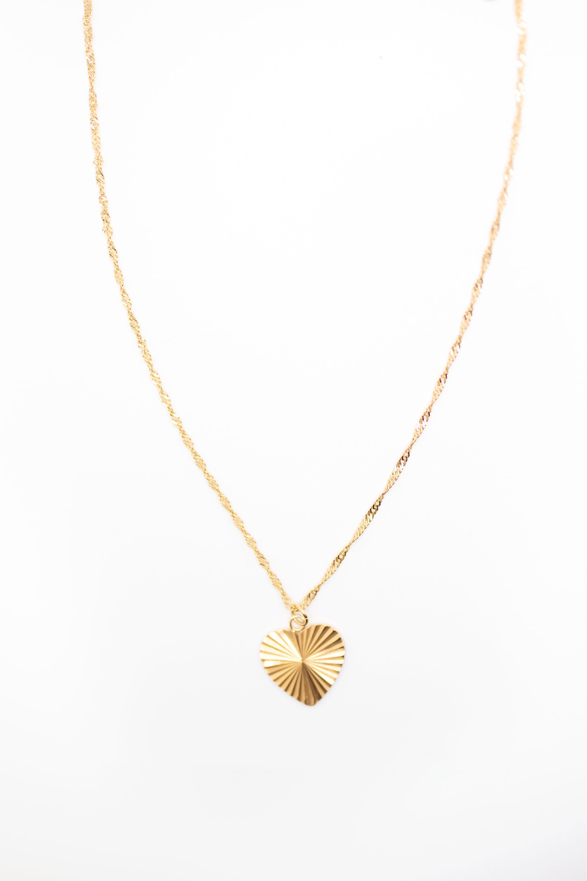 Twisted gold chain and heart necklace