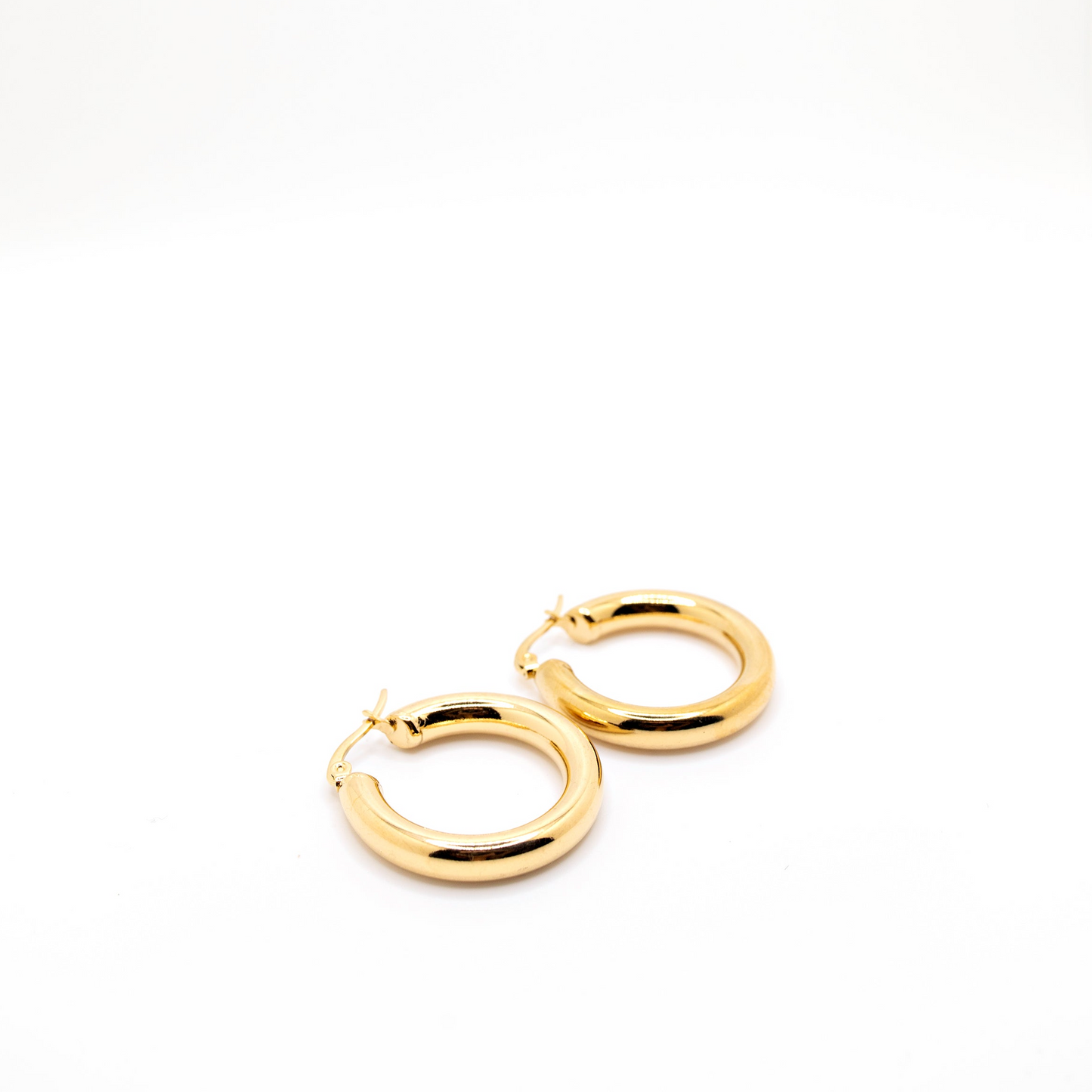 Chunky gold earrings with high gloss