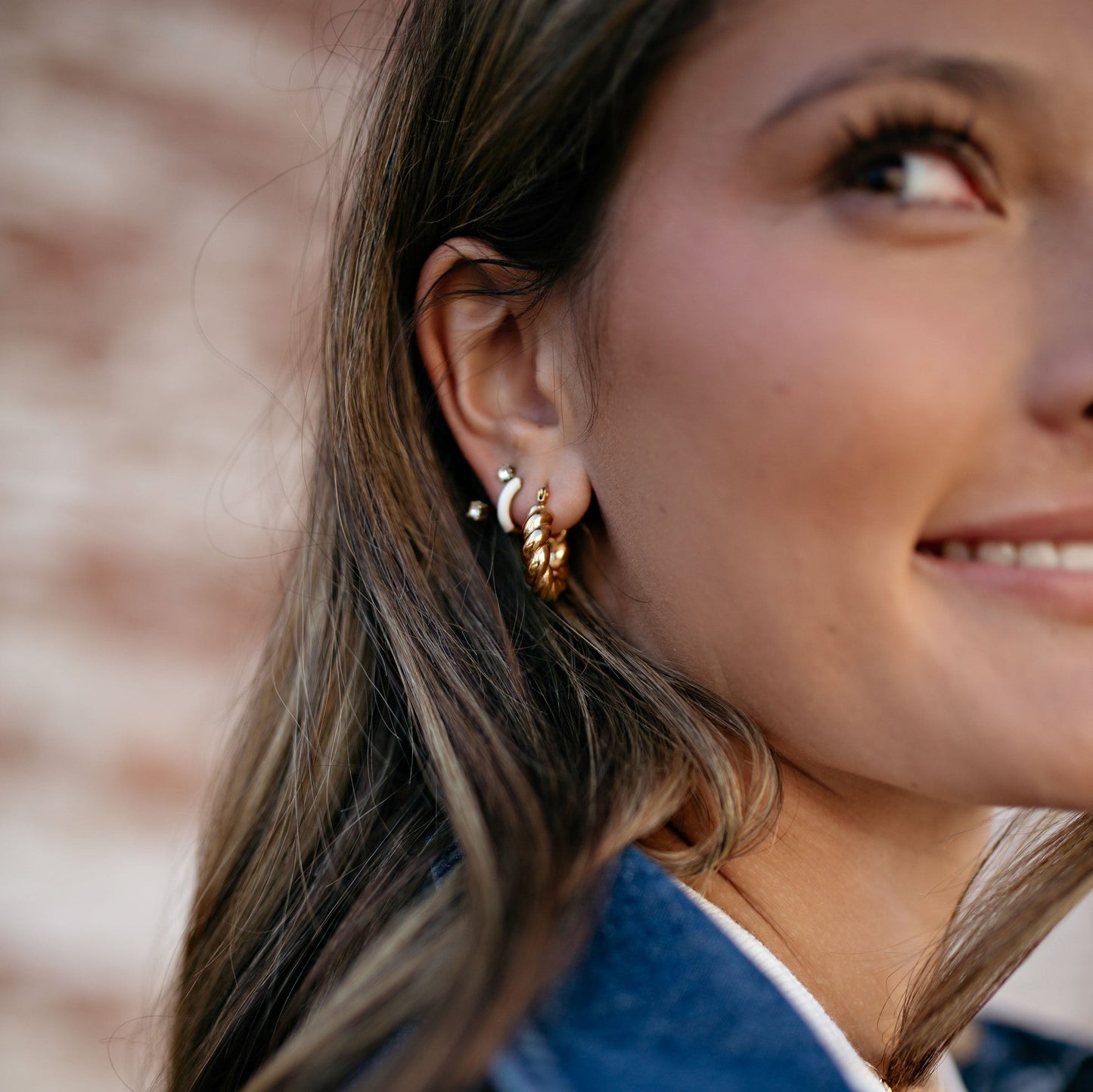 Downtown outfit with blue shirt and twist gold hoop earrings