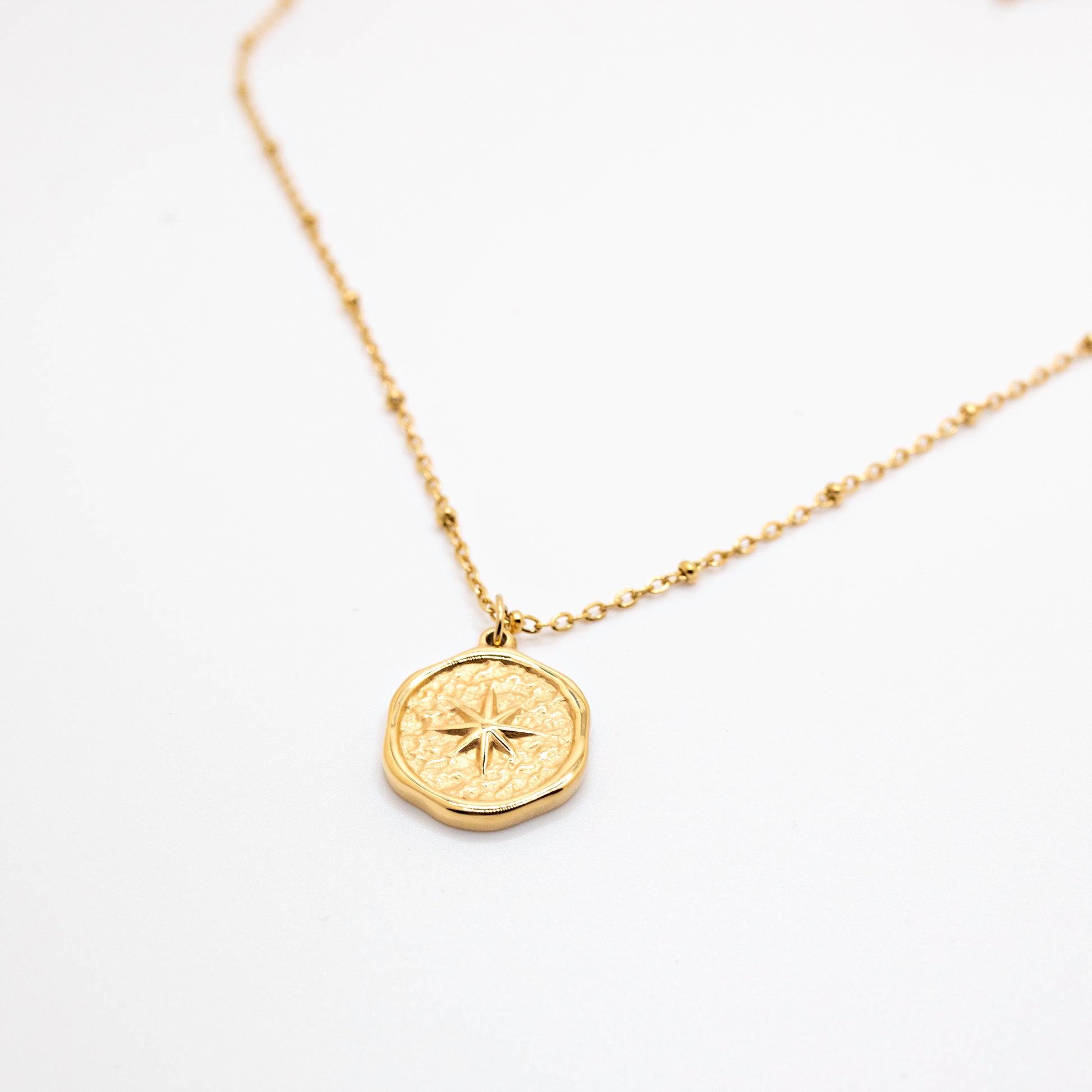 Gold vintage stamped compass necklace