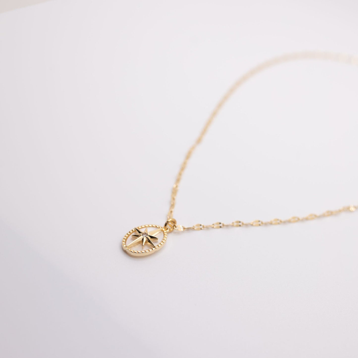 gold and crystal necklace with star charm