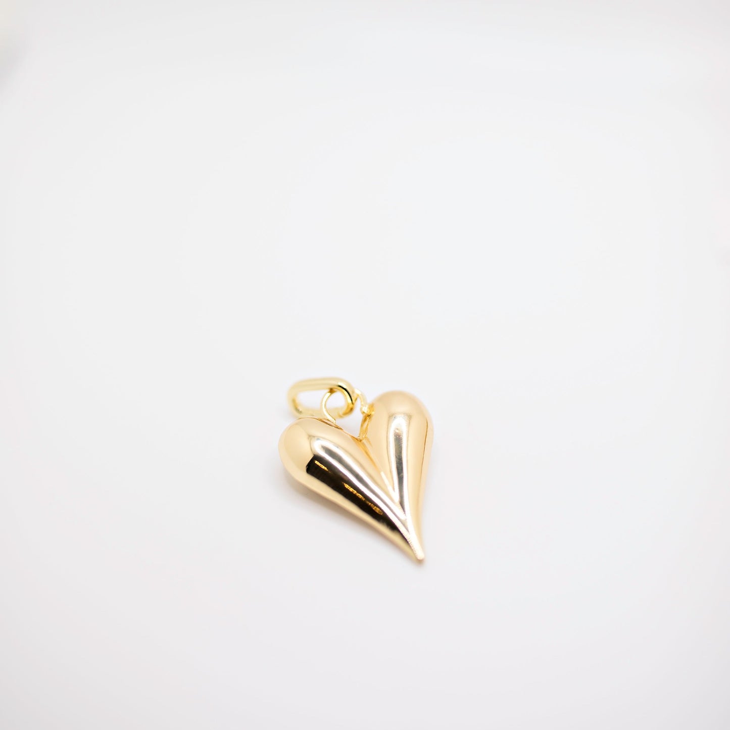 Heart charm in gold