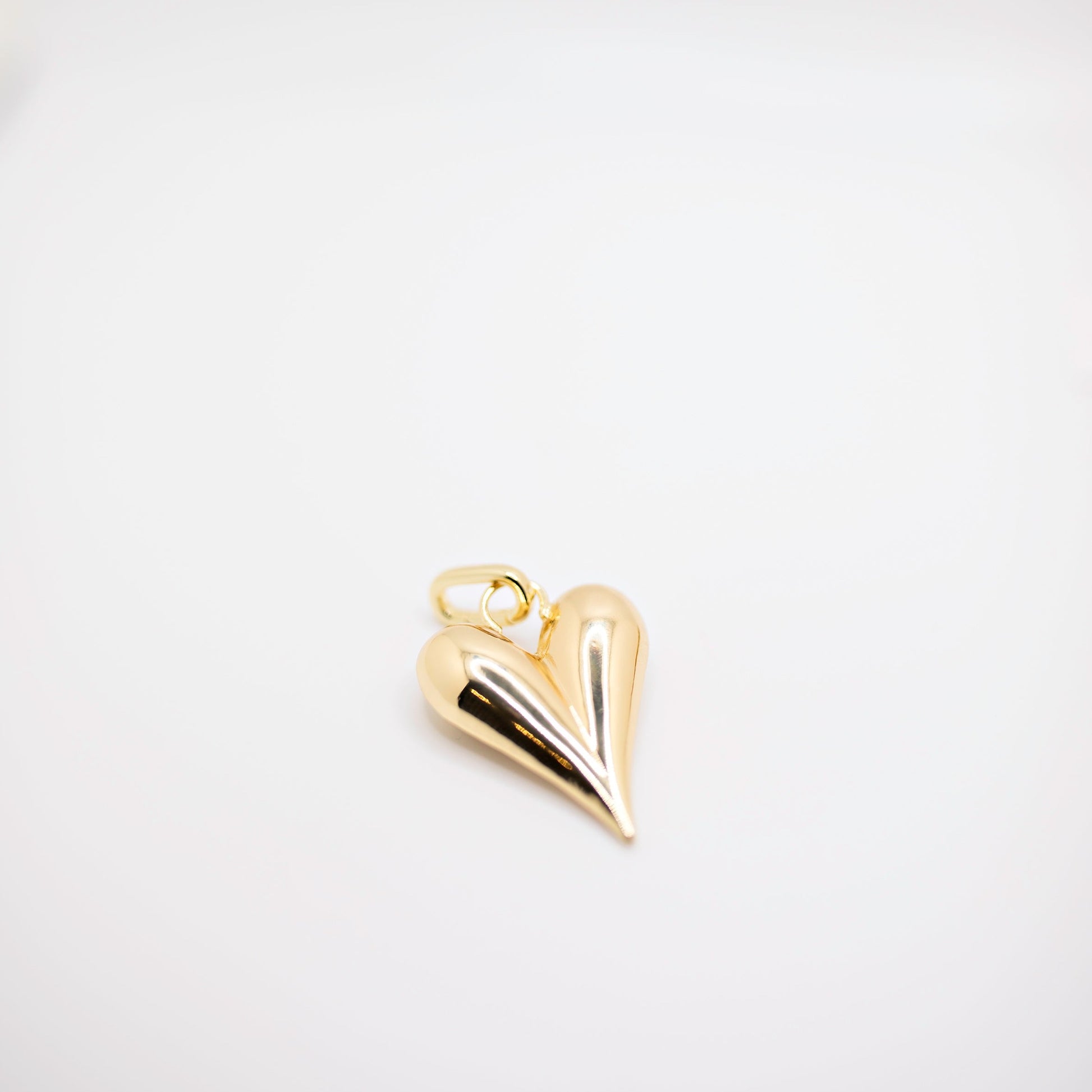 Heart charm in gold