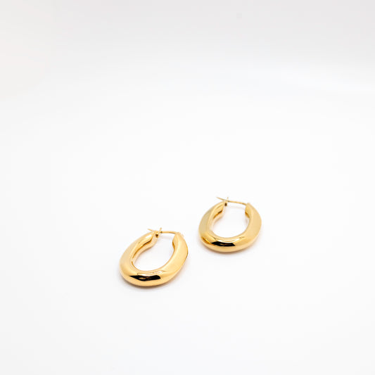 Gold hoop earrings in geometric shape