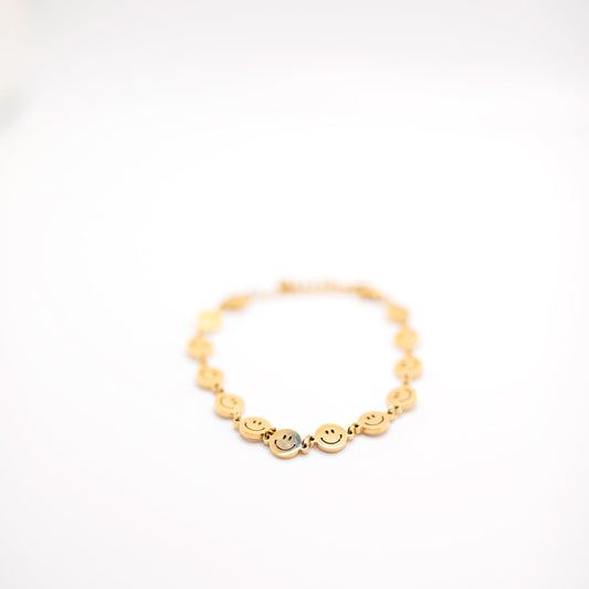 Gold smiley face charm bracelet