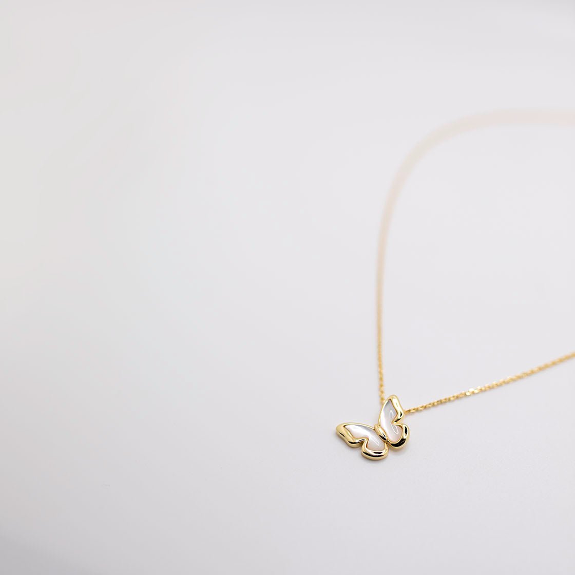 Gold butterfly necklace