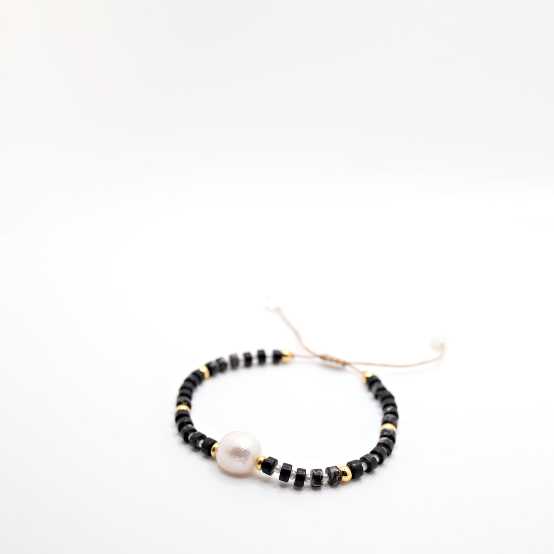 Black, white, and gold bracelet