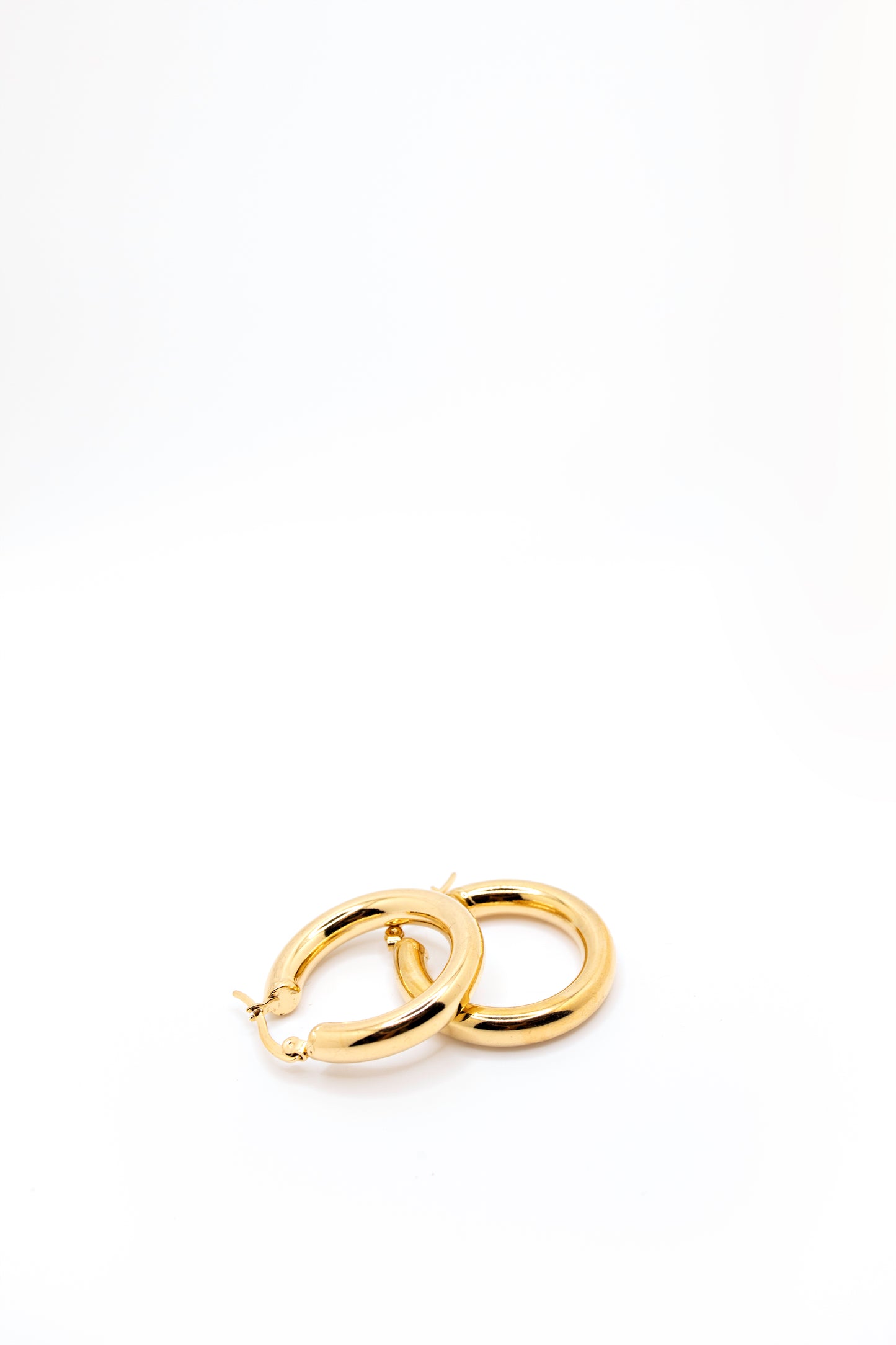 Gold hoop with hinge clasp