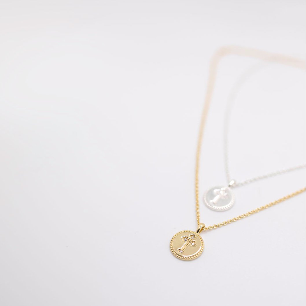 Gold and silver cross charm necklace