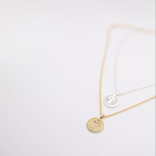 Gold and silver cross charm necklace