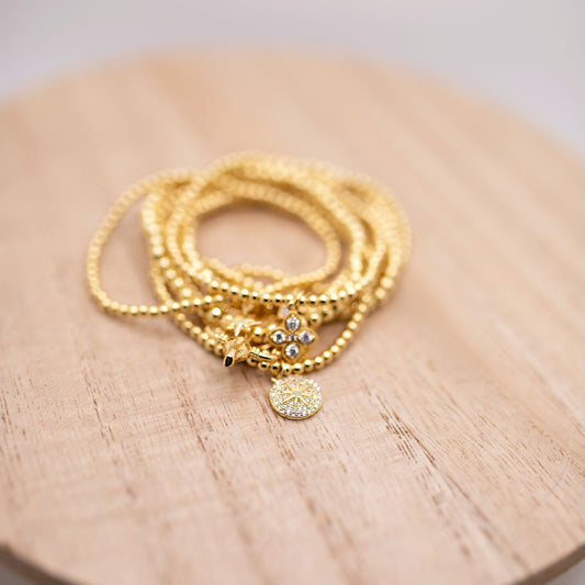 Gold Beaked Bracelets with charms