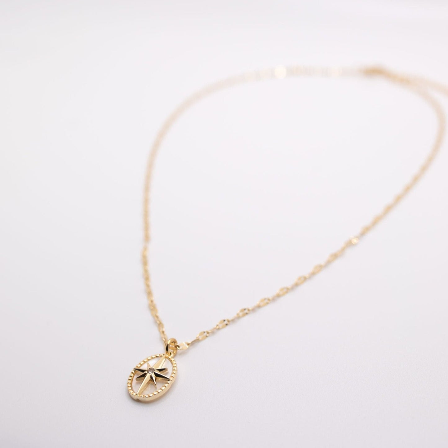 gold chain necklace with star and pearl pendant