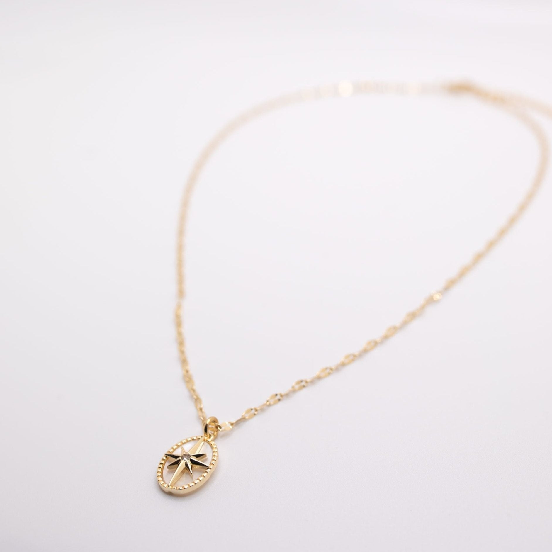 gold chain necklace with star and pearl pendant